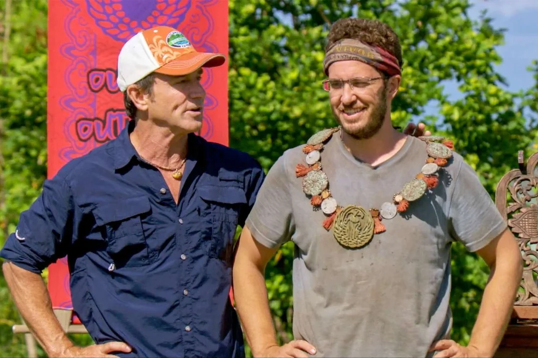 Rick Devens wearing the individual immunity necklace beside Jeff Probst