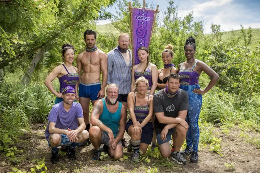 The Takali tribe posing in purple buffs in Survivor: Millennials vs. Gen X