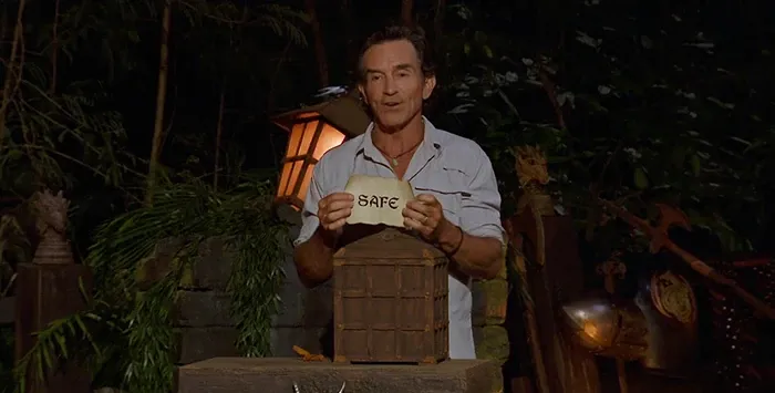 Jeff Probst holds up a Safe scroll at Tribal Council in Survivor 44
