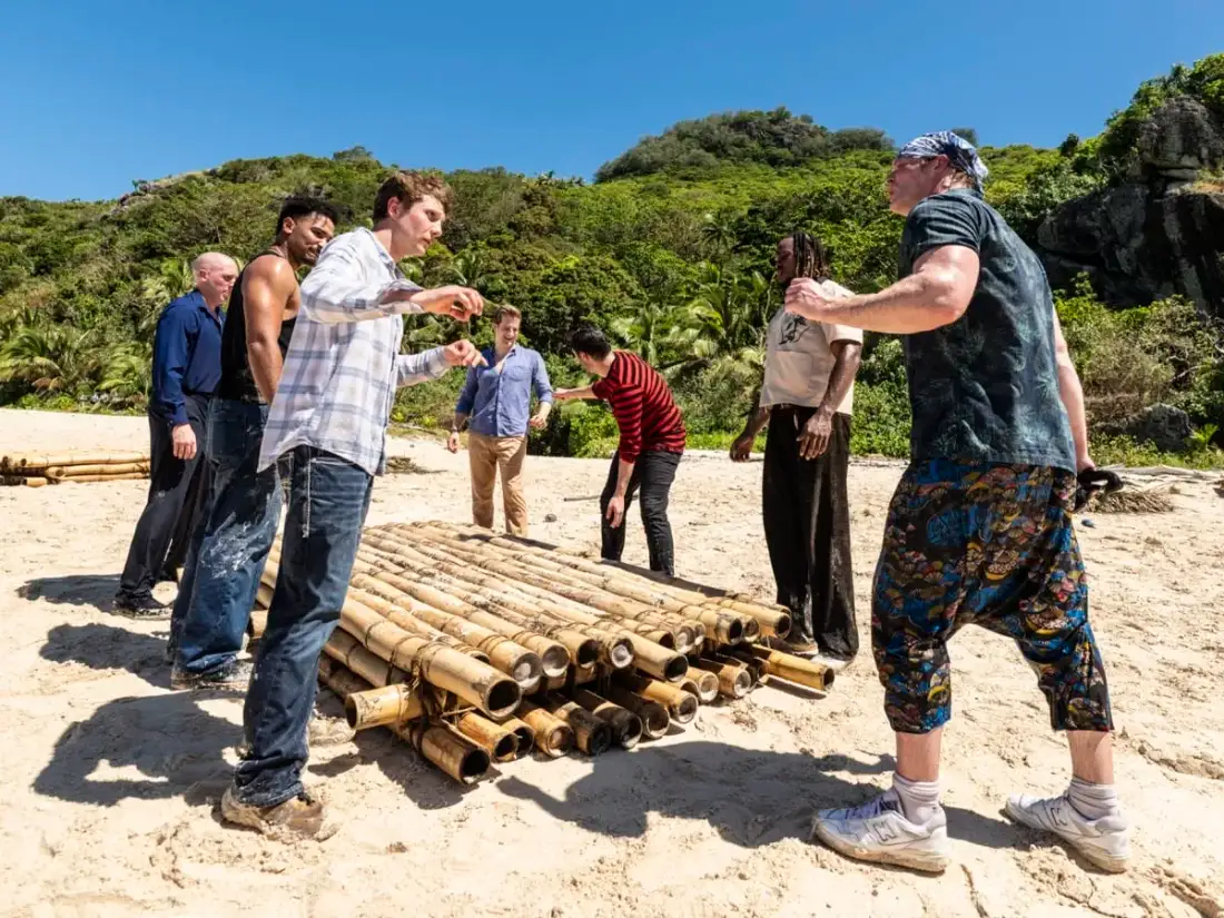 Survivor 51 castaways gathering bamboo to build camp on Day 1