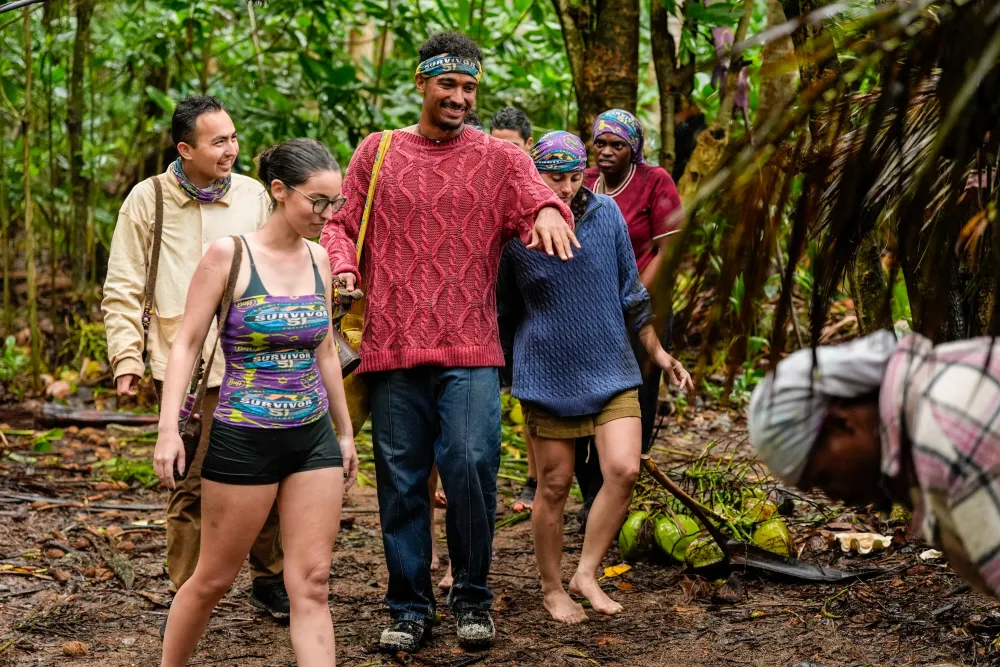 Devin Way walking through the jungle with Savu castaways during his Episode 3 visit