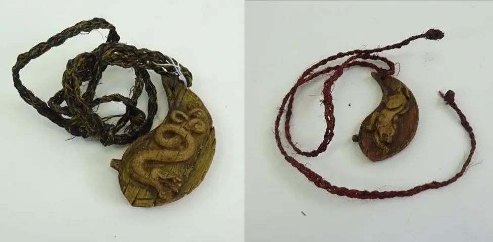 Two carved hidden immunity idols from Survivor: Kaoh Rong