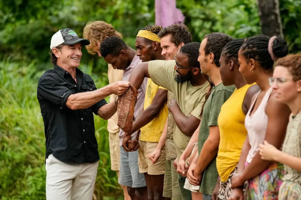 Jeff Probst with a line of castaways at Earn the Merge in Survivor 46
