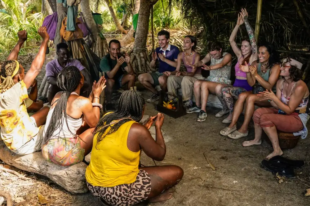 The Survivor 46 merged tribe celebrating together at camp