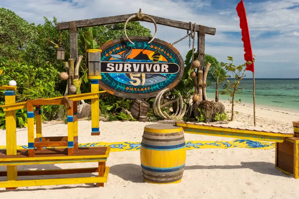 The empty Toka challenge station on the beach in Survivor 51 Episode 4, with the Survivor 51 logo and yellow and blue props